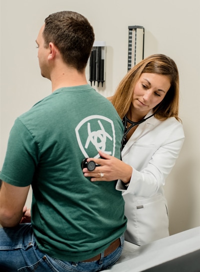 a nurse treating a patient