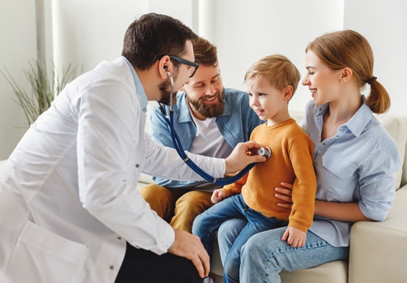 a doctor treating a young child